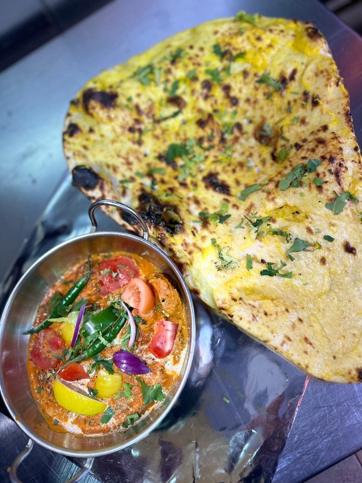 Curry served with naan at Shaban's Renfrew Takeaway